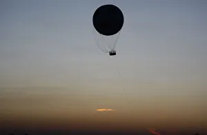 A hot air balloon the shape of a soccer ball flies in Soweto ahead of the Confederations A hot air balloon the shape of a soccer ball flies in Soweto ahead of the Confederations