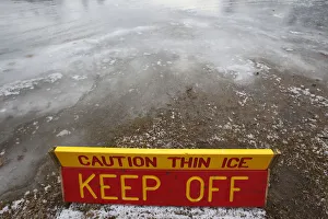 A thin ice warning is posted at Whites Pond in Concord, New Hampshire A thin ice warning is posted at Whites Pond in Concord, New Hampshire