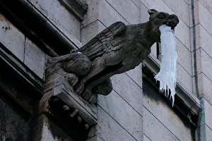 Icicles hang from a gargoyle on the Sacre Coeur basilica at the Butte Montmartre in Paris Icicles hang from a gargoyle on the Sacre Coeur basilica at the Butte Montmartre in Paris