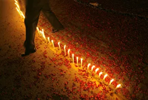 Indian soldier crosses over candles lit by school children during Vijay Divas in New Indian soldier crosses over candles lit by school children during Vijay Divas in New