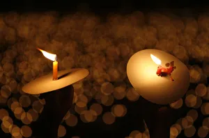 Indonesia Gallery: Indonesian Christians hold candles as they pray on Christmas eve at a cathedral in Surabaya