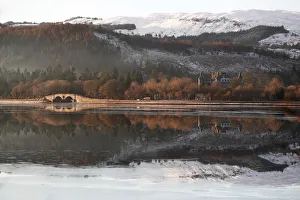 Inveraray Castle is reflected in Loch Fyne, Scotland Inveraray Castle is reflected in Loch Fyne, Scotland