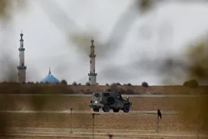 An Israeli military jeep drives near the area where the Israeli forces said a An Israeli military jeep drives near the area where the Israeli forces said a