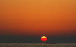 Jet ski rider enjoys the sunset at the Albanian beach of Durres Jet ski rider enjoys the sunset at the Albanian beach of Durres