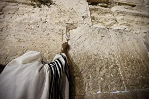 A Jewish worshipper prays at the Western Wall during prayers marking Tisha B'Av A Jewish worshipper prays at the Western Wall during prayers marking Tisha B'Av