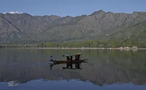 A Kashmiri man rows his boat on the waters of Dal Lake in Srinagar A Kashmiri man rows his boat on the waters of Dal Lake in Srinagar