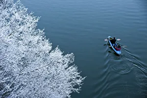 Kayakers paddle on Unica River in Rakov Skocjan Kayakers paddle on Unica River in Rakov Skocjan