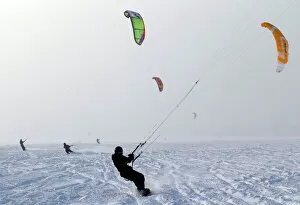 Images Dated 4th February 2012: Kite surfers take advantage of the frozen Puck Bay in Chalupy