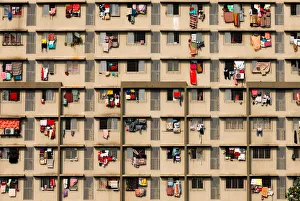 Laundry is seen hanging on the windows of a residential building in Mumbai Laundry is seen hanging on the windows of a residential building in Mumbai