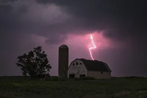 Lighting strikes over a barn surrounded by a soybean crop in Donnellson, Iowa Lighting strikes over a barn surrounded by a soybean crop in Donnellson, Iowa