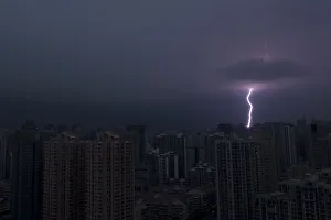 Lightning is seen above buildings during a storm in central Shanghai Lightning is seen above buildings during a storm in central Shanghai