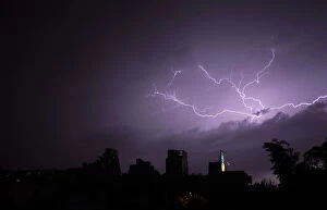 Images Dated 4th April 2011: Lightning strikes over buildings during a thunderstorm in Buenos Aires