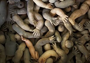 Images Dated 25th August 2014: Limbs of dolls are shown as spare parts in a pile ready to be used in customers doll
