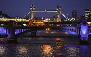A London bus crosses the River Thames on London Bridge during the evening rush hour A London bus crosses the River Thames on London Bridge during the evening rush hour