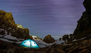 A long exposure picture shows stars and meteor trails above the mountains of Tien Shan A long exposure picture shows stars and meteor trails above the mountains of Tien Shan