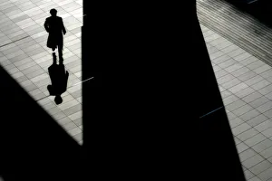 Man casts his shadow on the ground at Akihabara Electric Town, the largest electronics Man casts his shadow on the ground at Akihabara Electric Town, the largest electronics