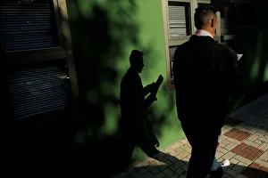 A man checks his documents after leaving a government-run job centre in Malaga A man checks his documents after leaving a government-run job centre in Malaga