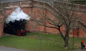 Images Dated 11th December 2016: A man and his children look at a historic steam engine passing by on the museum rail