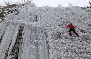 A man climbs an artificial wall of ice in the city of Liberec A man climbs an artificial wall of ice in the city of Liberec