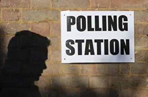 A man enters a polling station as voting begins in local government elections in London A man enters a polling station as voting begins in local government elections in London