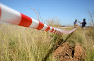 Man gestures as he uses tape to mark vacant land in Olievenhoutbosch near Centurion Man gestures as he uses tape to mark vacant land in Olievenhoutbosch near Centurion