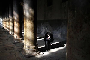 Images Dated 24th December 2011: A man prays inside the Church of the Nativity in West Bank town of Bethlehem