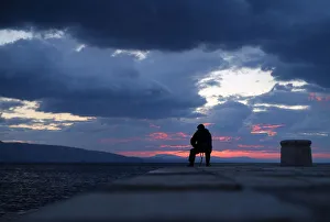 A man is seen fishing during the sunset in Senj A man is seen fishing during the sunset in Senj