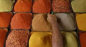 A man sells spices at a market in Karachi
