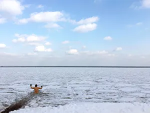 A man takes a bath in partly frozen Baltic sea in Gdynia A man takes a bath in partly frozen Baltic sea in Gdynia