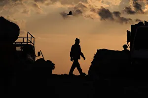 A man walks to collect recyclable items in Managuas municipal garbage dump known as La A man walks to collect recyclable items in Managuas municipal garbage dump known as La