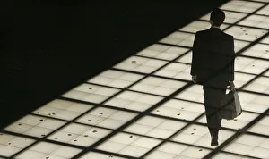 A man walks on an illuminated walkway in Tokyo A man walks on an illuminated walkway in Tokyo