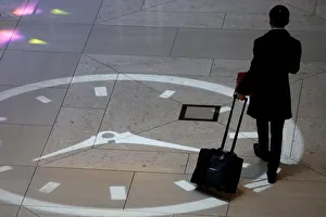 A man walks inside the mall of a commercial tower at the financial Central district A man walks inside the mall of a commercial tower at the financial Central district
