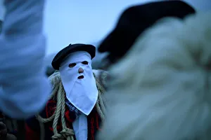 A masked man wearing a Basque beret takes part in carnival celebrations in Alsasua A masked man wearing a Basque beret takes part in carnival celebrations in Alsasua