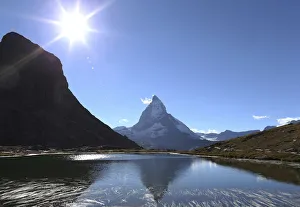 The Matterhorn mountain is reflected in the lake Riffel near Zermatt The Matterhorn mountain is reflected in the lake Riffel near Zermatt