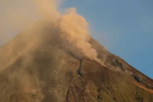Mayon Volcano emits lava and ash during a mild eruption hours after a total lunar eclipse Mayon Volcano emits lava and ash during a mild eruption hours after a total lunar eclipse