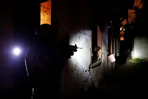 A member of Turkish police special forces takes part in a drug raid in Istanbul A member of Turkish police special forces takes part in a drug raid in Istanbul