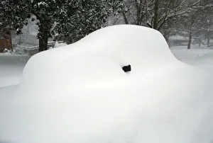 A mirror is all that can be seen of a snow covered car in Falls Church, Virginia A mirror is all that can be seen of a snow covered car in Falls Church, Virginia