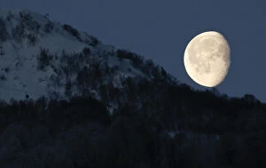 Related Images Gallery: Moon is pictured above the mountains in Rosa Khutor during the 2014 Sochi Winter Olympics