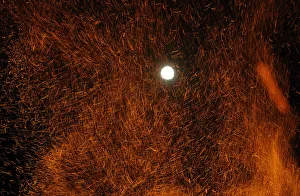A full moon also referred to as a super moon rises over the San Juan bonfire on the A full moon also referred to as a super moon rises over the San Juan bonfire on the