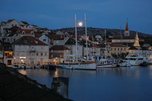 The moon rises over the town of Milna on the island of Brac The moon rises over the town of Milna on the island of Brac