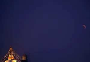 A full moon is seen during the lunar eclipse as it rises behind the Swayambhunath Stupa A full moon is seen during the lunar eclipse as it rises behind the Swayambhunath Stupa