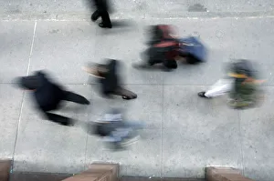 Morning commuters walk the city sidewalks of New York Morning commuters walk the city sidewalks of New York