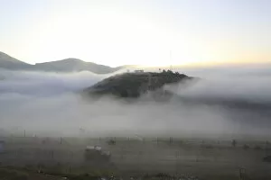 Images Dated 6th June 2011: Morning mist covers the Israeli-Syrian border near Majdal Shams in the Golan Heights