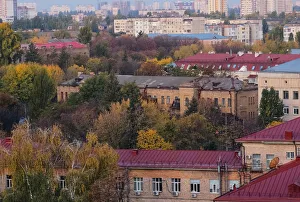 The morning sun shines on buildings and autumnal trees in an unusually hot autumn in Kiev The morning sun shines on buildings and autumnal trees in an unusually hot autumn in Kiev