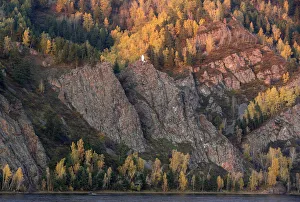 A motorboat sails along the Yenisei River in Taiga area during sunset outside Krasnoyarsk A motorboat sails along the Yenisei River in Taiga area during sunset outside Krasnoyarsk