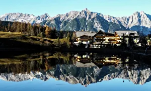 Mountains are reflected in a small lake on a sunny autumn day in the western Austrian Mountains are reflected in a small lake on a sunny autumn day in the western Austrian