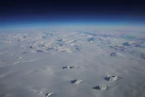 Mountains stick up through a massive ice sheet covering Greenland near the eastern coast Mountains stick up through a massive ice sheet covering Greenland near the eastern coast