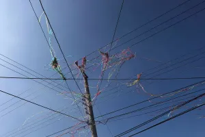 Prints of Color ribbon are seen on overhead power lines after firecrackers were set off during Beehive Firecrackers festival at the Yanshui district in Tainan, Taiwan March 1, 2018. REUTERS/Tyrone Siu Tyrone Prints: Color ribbon print on overhead power lines