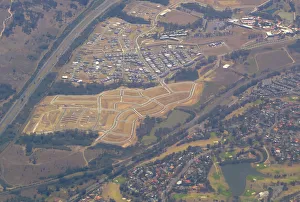 Newly constructed roads for a future housing estate can be seen near houses in western Newly constructed roads for a future housing estate can be seen near houses in western