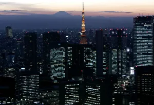 Night view shows Japans highest Mt. Fuji seen beyond Tokyo Tower and Shiodome district Night view shows Japans highest Mt. Fuji seen beyond Tokyo Tower and Shiodome district